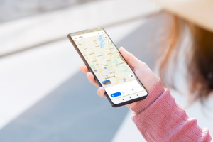 Female looking at Google Maps on her phone